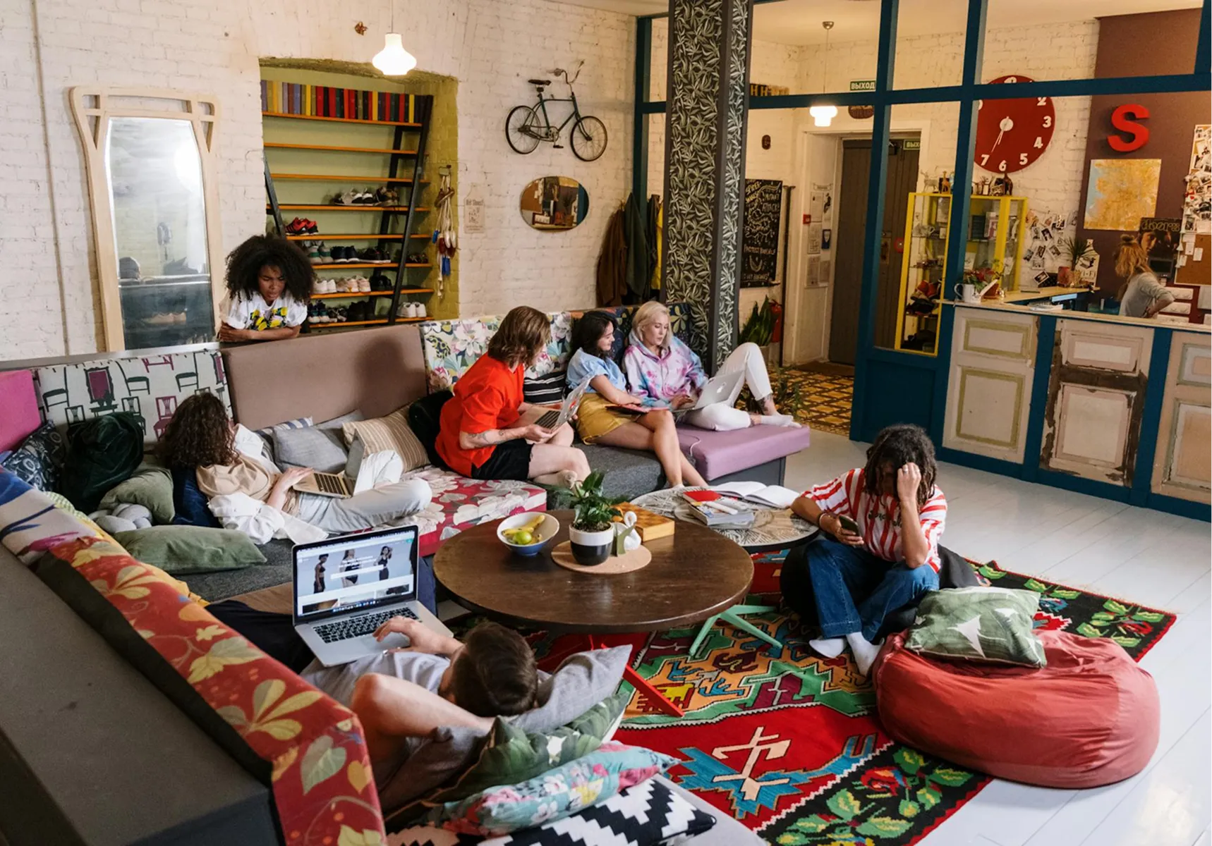 People relaxing together in a bright, colourful space